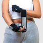 woman female wrapping the wrist support of the gym gloves around her wrist for a stable grip. 