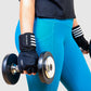 woman using a high quality gym gloves while holding dumbbells.
