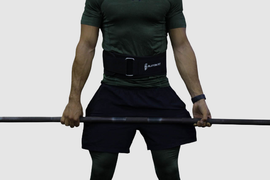 man using power lifting belt to left in squats and deadlifts
